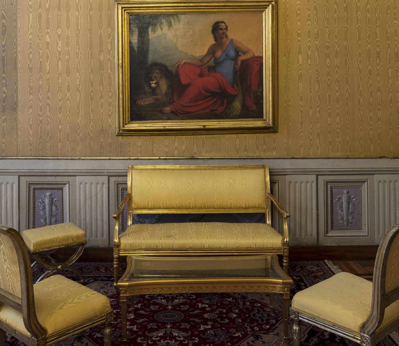 The Zephyr and Flora Lounge: wall with a painting illustrating the continent of Africa, represented by a woman with a lion crouching at her feet and corals on her ears, features alluding to the continent’s animals and its costumes.